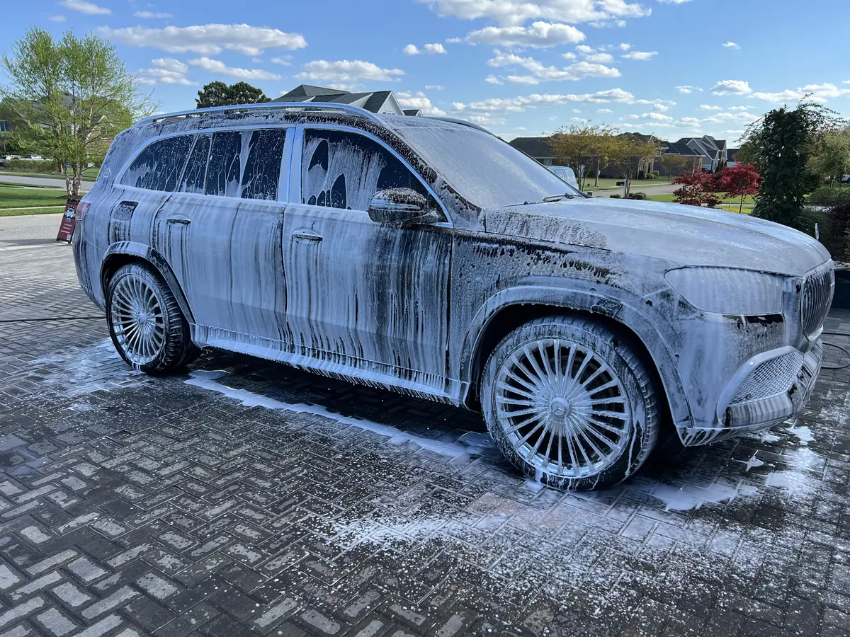 TMC Detailing hand washing a luxury SUV